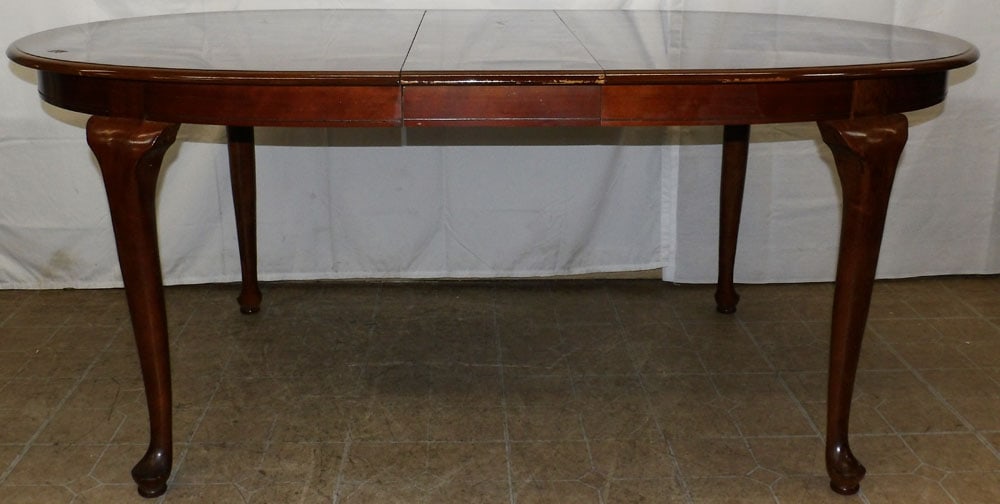 Oval Cherry Dining Table with One Leaf: Oval Cherry Dining Table with One Leaf. 29 3/4" H 73" W 41 1/2" D "ALL DESCRIPTIONS AND ANY CONDITION STATEMENT GIVEN BY LANGSTON AUCTION GALLERY ARE STRICTLY OPINIONS AND LANGSTON'S SHALL HAVE NO