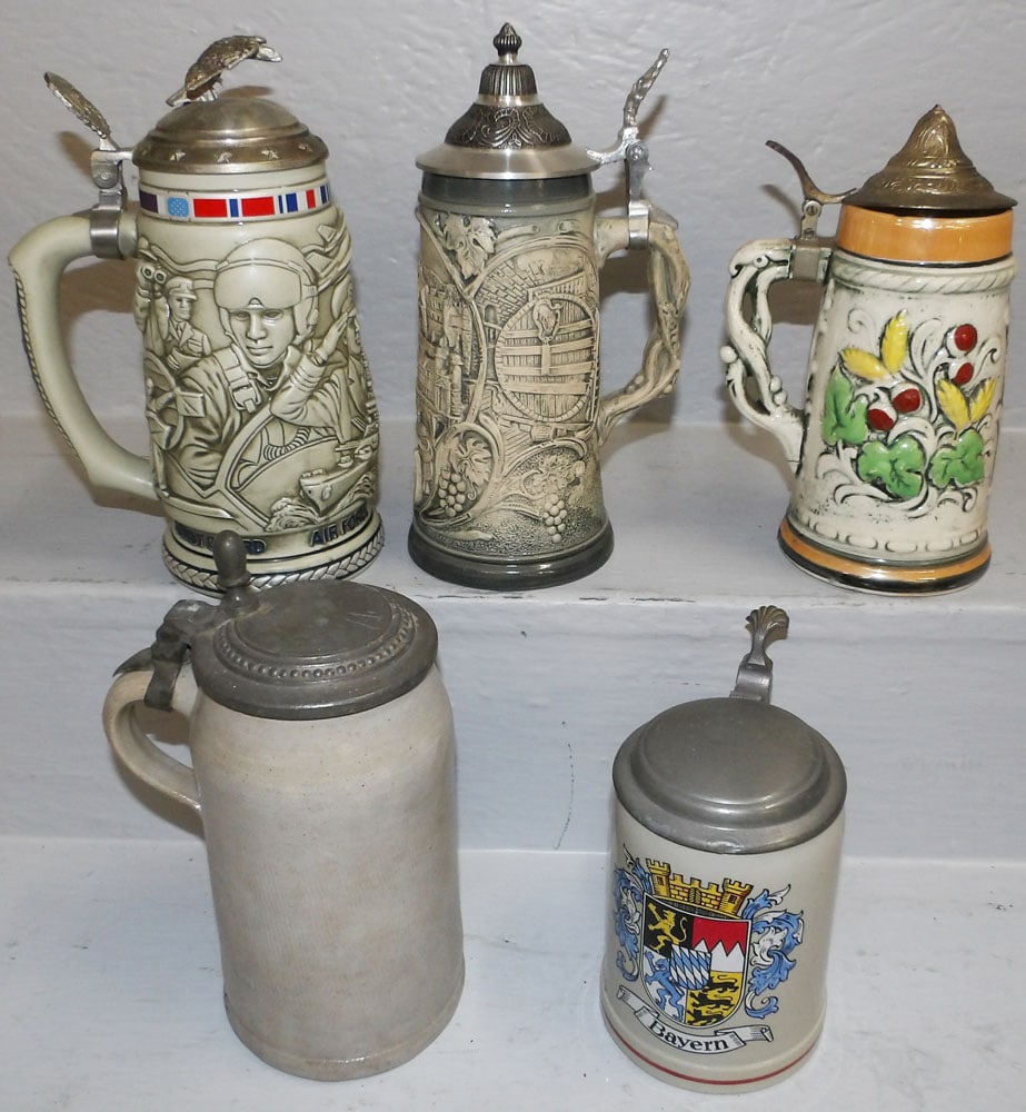 Lot of Porcelain Beer Steins with Pewter Tops: Lot of Porcelain Beer Steins with Pewter Tops . Up to 9 1/4" H 6" W "ALL DESCRIPTIONS AND ANY CONDITION STATEMENT GIVEN BY LANGSTON AUCTION GALLERY ARE STRICTLY OPINIONS AND LANGSTON'S SHALL HAVE NO