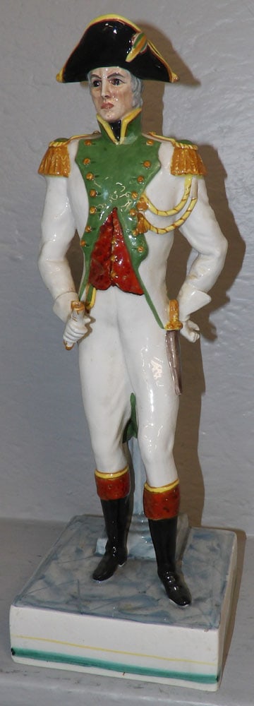 Painted Porcelain Soldier Figure with Restoration: Painted Porcelain Soldier Figure with Restoration . 17" H 5 3/4" W 5 3/4" D "ALL DESCRIPTIONS AND ANY CONDITION STATEMENT GIVEN BY LANGSTON AUCTION GALLERY ARE STRICTLY OPINIONS AND LANGSTON'S SHALL