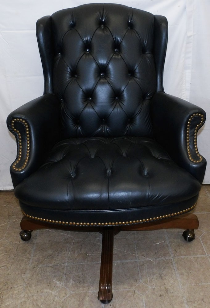 Faux Leather Upholstered Desk Chair: Faux Leather Upholstered Desk Chair. 39 1/2" H 28 1/2" W 28" D "ALL DESCRIPTIONS AND ANY CONDITION STATEMENT GIVEN BY LANGSTON AUCTION GALLERY ARE STRICTLY OPINIONS AND LANGSTON'S SHALL HAVE NO