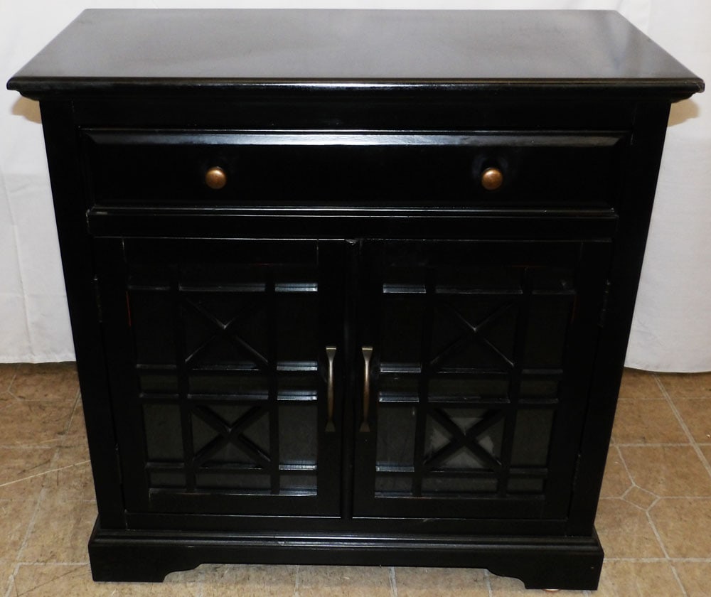 Black Lacquered One Drawer Glass Door Cabinet: Black Lacquered One Drawer Glass Door Cabinet. 32 1/2" H 32" W 15" D "ALL DESCRIPTIONS AND ANY CONDITION STATEMENT GIVEN BY LANGSTON AUCTION GALLERY ARE STRICTLY OPINIONS AND LANGSTON'S SHALL HAVE NO