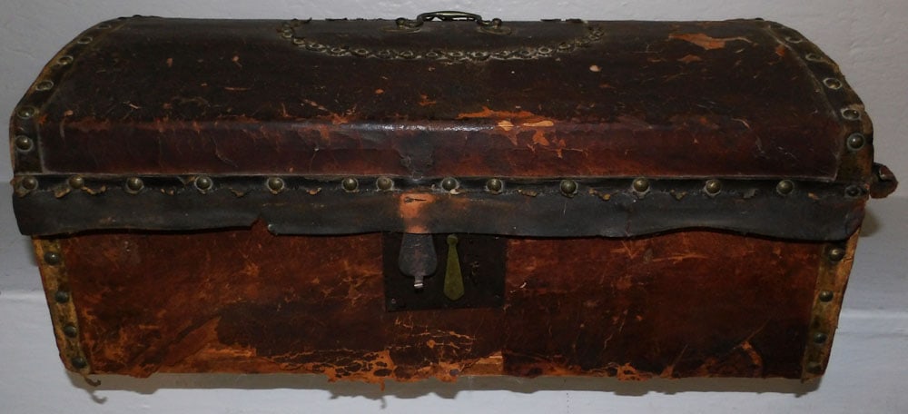 Antique Leather Bound Trunk: Antique Leather Bound Trunk. 8 1/4" H 20 1/2" W 10 1/2" D "ALL DESCRIPTIONS AND ANY CONDITION STATEMENT GIVEN BY LANGSTON AUCTION GALLERY ARE STRICTLY OPINIONS AND LANGSTON'S SHALL HAVE NO