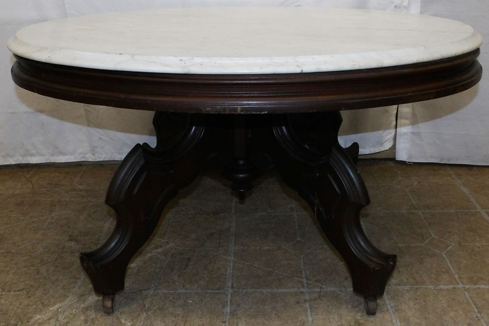 Antique Oval Walnut Victorian Marble Top Coffee Table: Antique Oval Walnut Victorian Marble Top Coffee Table. 19" H 35 1/4" W 26 3/4" D "ALL DESCRIPTIONS AND ANY CONDITION STATEMENT GIVEN BY LANGSTON AUCTION GALLERY ARE STRICTLY OPINIONS AND LANGSTON'S SH