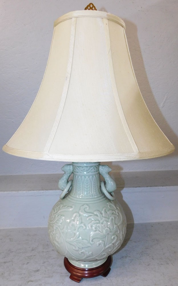 Oriental Celadon Porcelain Urn Made Into Lamp: Oriental Celadon Porcelain Urn Made Into Lamp. 28 1/2" H Shade: 17" Dia. ALL DESCRIPTIONS AND ANY CONDITION STATEMENT GIVEN BY LANGSTON AUCTION GALLERY ARE STRICTLY OPINIONS AND LANGSTON'S SHALL HAVE