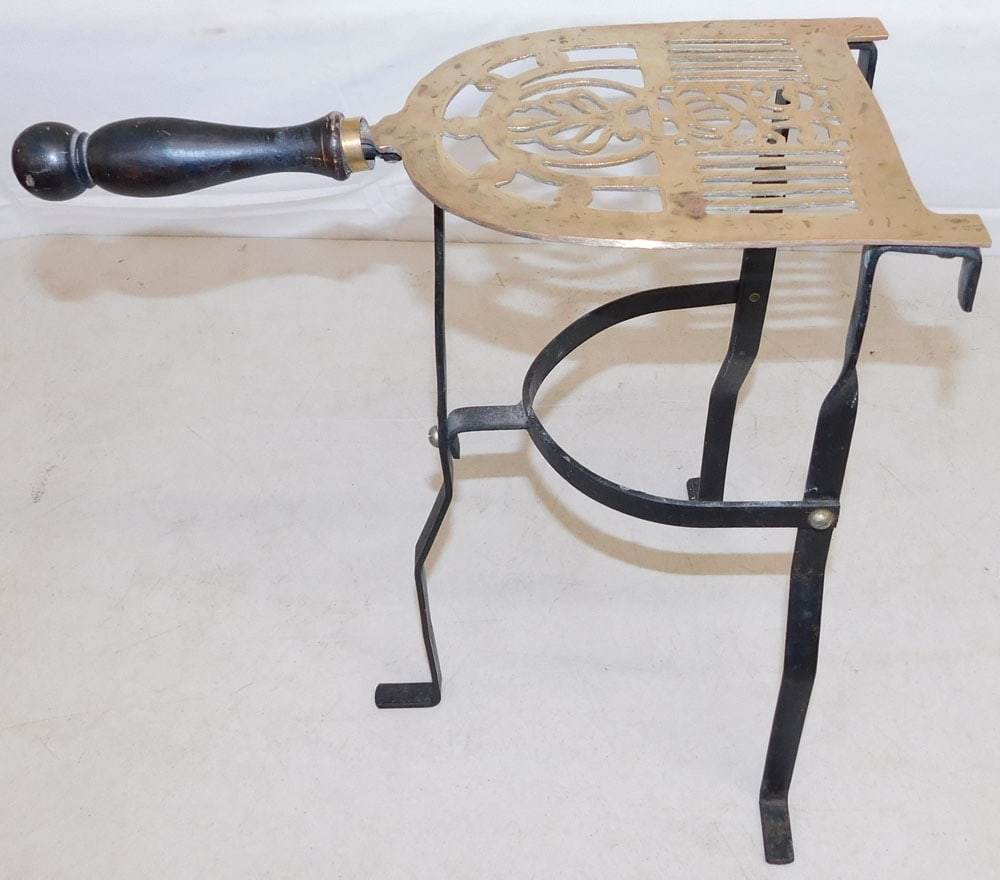Brass & Wrought Iron Trivet: Brass & Wrought Iron Trivet . 14" H 14 1/4" W ALL DESCRIPTIONS AND ANY CONDITION STATEMENT GIVEN BY LANGSTON AUCTION GALLERY ARE STRICTLY OPINIONS AND LANGSTON'S SHALL HAVE NO RESPONSIBILITY FOR ERROR