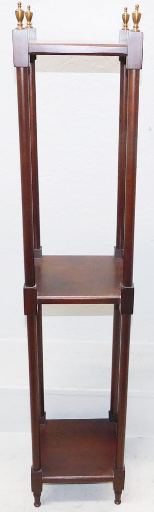 Mahogany Three Tier Stand with Brass Finials: Mahogany Three Tier Stand with Brass Finials. 41 1/2" H 8 1/4" Dia. ALL DESCRIPTIONS AND ANY CONDITION STATEMENT GIVEN BY LANGSTON AUCTION GALLERY ARE STRICTLY OPINIONS AND LANGSTON'S SHALL HAVE NO