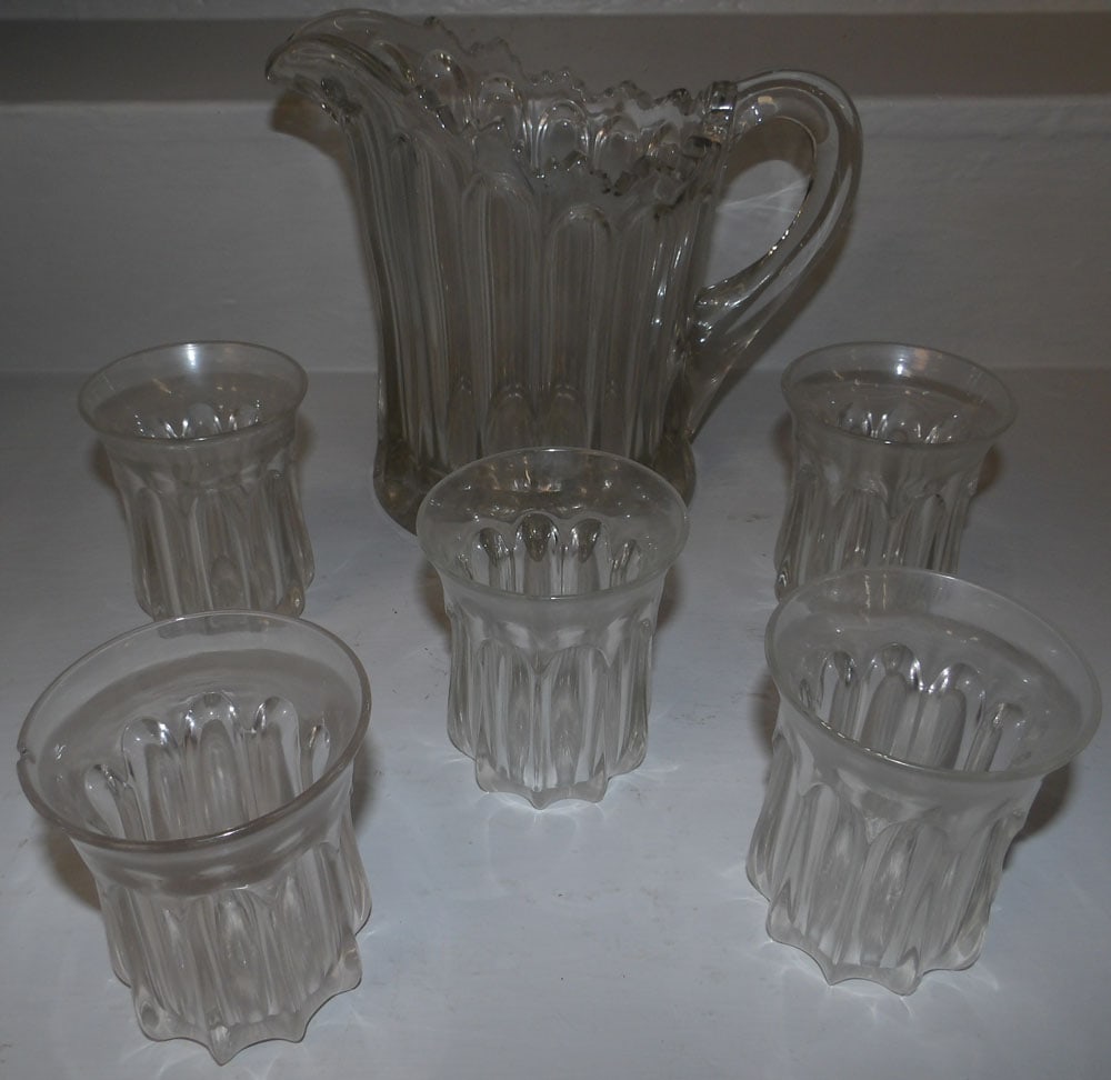Antique Pattern Glass Lemonade Pitcher with Five Tumblers: Antique Pattern Glass Lemonade Pitcher with Five Tumblers. 8 1/4" H 9 3/4" W ALL DESCRIPTIONS AND ANY CONDITION STATEMENT GIVEN BY LANGSTON AUCTION GALLERY ARE STRICTLY OPINIONS AND LANGSTON'S SHALL