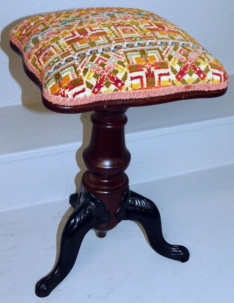 Antique Rotating Victorian Adjustable Piano Stool with Cast Iron Legs: Antique Rotating Victorian Adjustable Piano Stool with Cast Iron Legs. 19 1/2" H 12 1/4" Dia. ALL DESCRIPTIONS AND ANY CONDITION STATEMENT GIVEN BY LANGSTON AUCTION GALLERY ARE STRICTLY OPINIONS AND L
