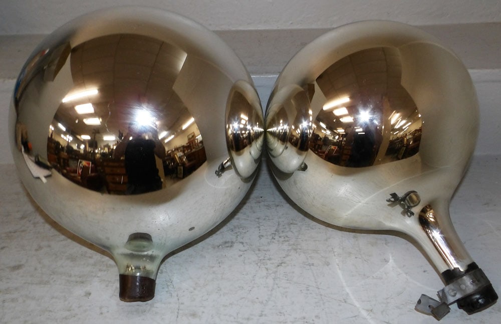 Two Decorative Mercury Glass Spheres: Two Decorative Mercury Glass Spheres. Up to 10 1/2" Dia. ALL DESCRIPTIONS AND ANY CONDITION STATEMENT GIVEN BY LANGSTON AUCTION GALLERY ARE STRICTLY OPINIONS AND LANGSTON'S SHALL HAVE NO