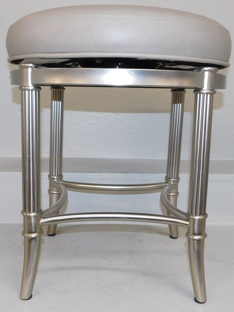 Modern Steel & Faux Leather Top Revolving Stool: Modern Steel & Faux Leather Top Revolving Stool . 20" H 18" Dia. ALL DESCRIPTIONS AND ANY CONDITION STATEMENT GIVEN BY LANGSTON AUCTION GALLERY ARE STRICTLY OPINIONS AND LANGSTON'S SHALL HAVE NO RESPO