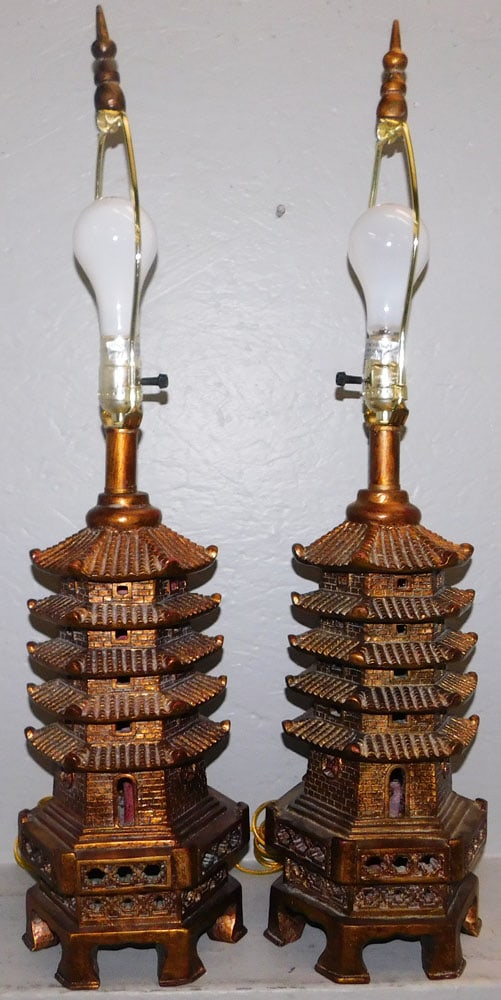 Pair of Gilded Resin Pagoda Form Oriental Lamps: Pair of Gilded Resin Pagoda Form Oriental Lamps. 30" H 8" Dia. ALL DESCRIPTIONS AND ANY CONDITION STATEMENT GIVEN BY LANGSTON AUCTION GALLERY ARE STRICTLY OPINIONS AND LANGSTON'S SHALL HAVE NO RESPONS