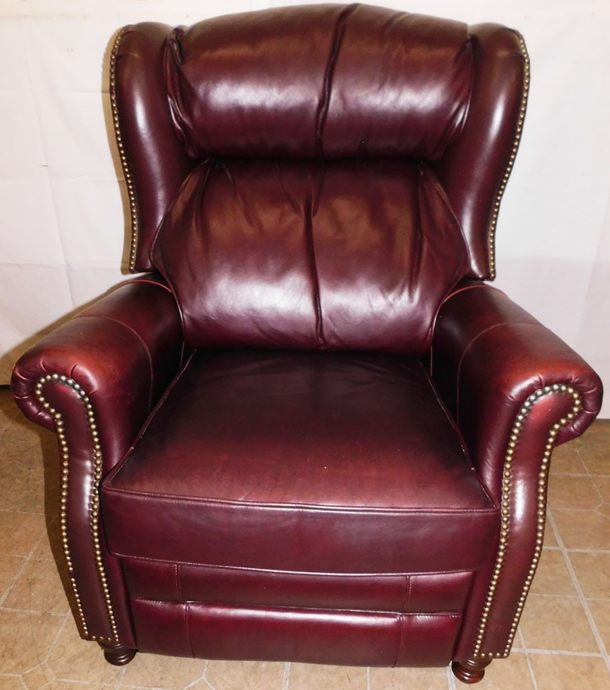 Leather Recliner: Leather Recliner . 40 3/4" H 33" W 34" D ALL DESCRIPTIONS AND ANY CONDITION STATEMENT GIVEN BY LANGSTON AUCTION GALLERY ARE STRICTLY OPINIONS AND LANGSTON'S SHALL HAVE NO RESPONSIBILITY FOR ERRORS OR