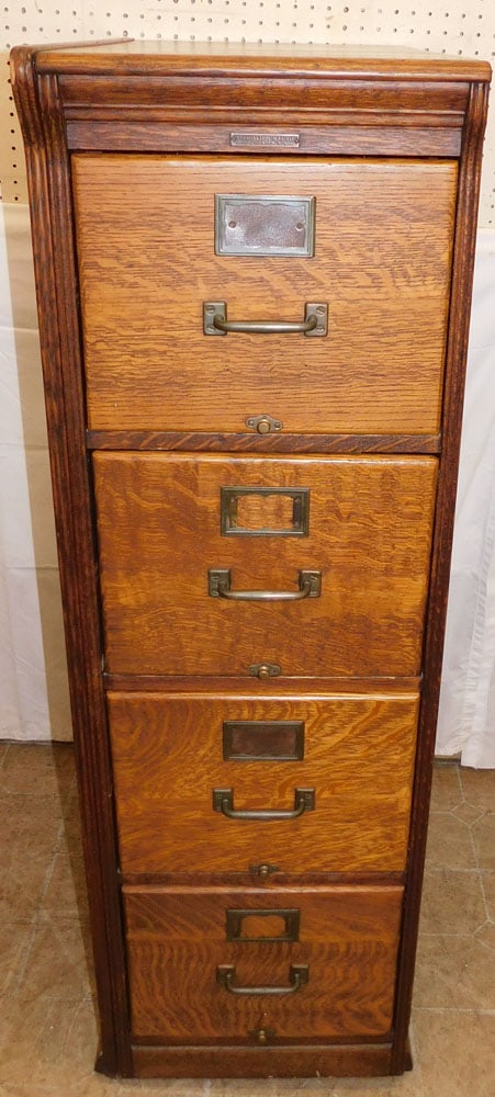 Antique Oak Four Drawer Filing Cabinet by Yawman & Erbe MFG. Co. Rochester, NY: Antique Oak Four Drawer Filing Cabinet by Yawman & Erbe MFG. Co. Rochester, NY. 53 3/4" H 17" W 29" D ALL DESCRIPTIONS AND ANY CONDITION STATEMENT GIVEN BY LANGSTON AUCTION GALLERY ARE STRICTLY