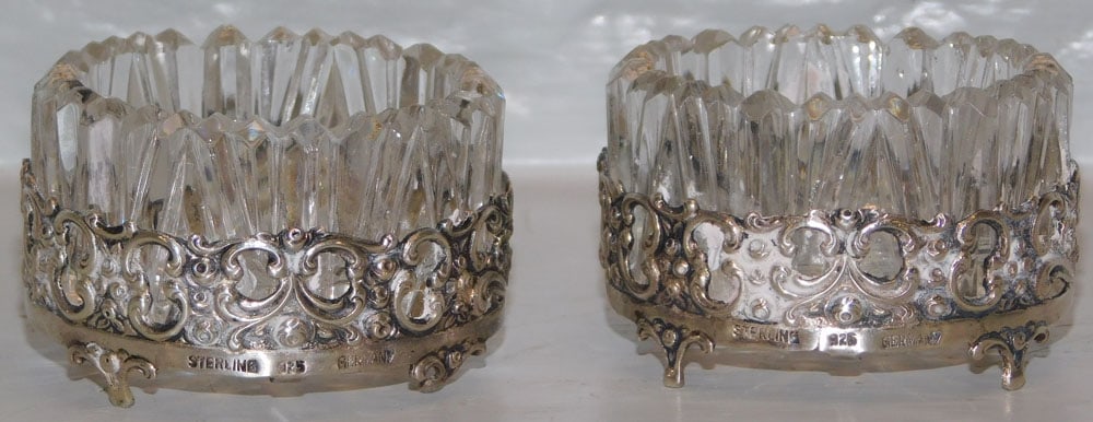 Pair of Antique German Sterling & Cut Glass Salt Cellars: Pair of Antique German Sterling & Cut Glass Salt Cellars . 1 1/4" H 2" Dia. ALL DESCRIPTIONS AND ANY CONDITION STATEMENT GIVEN BY LANGSTON AUCTION GALLERY ARE STRICTLY OPINIONS AND LANGSTON'S SHALL HA