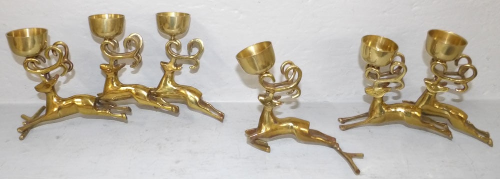 Three Brass Deer Form Candleholders: Three Brass Deer Form Candleholders. Up to 6" H 11 1/2" W "ALL DESCRIPTIONS AND ANY CONDITION STATEMENT GIVEN BY LANGSTON AUCTION GALLERY ARE STRICTLY OPINIONS AND LANGSTON'S SHALL HAVE NO