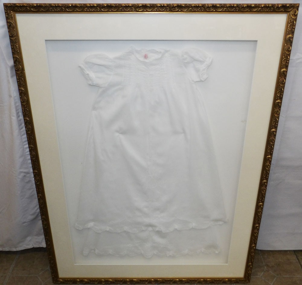 Framed Child's Dress: Framed Child's Dress. 40 3/4" x 31" "ALL DESCRIPTIONS AND ANY CONDITION STATEMENT GIVEN BY LANGSTON AUCTION GALLERY ARE STRICTLY OPINIONS AND LANGSTON'S SHALL HAVE NO RESPONSIBILITY FOR ERRORS OR