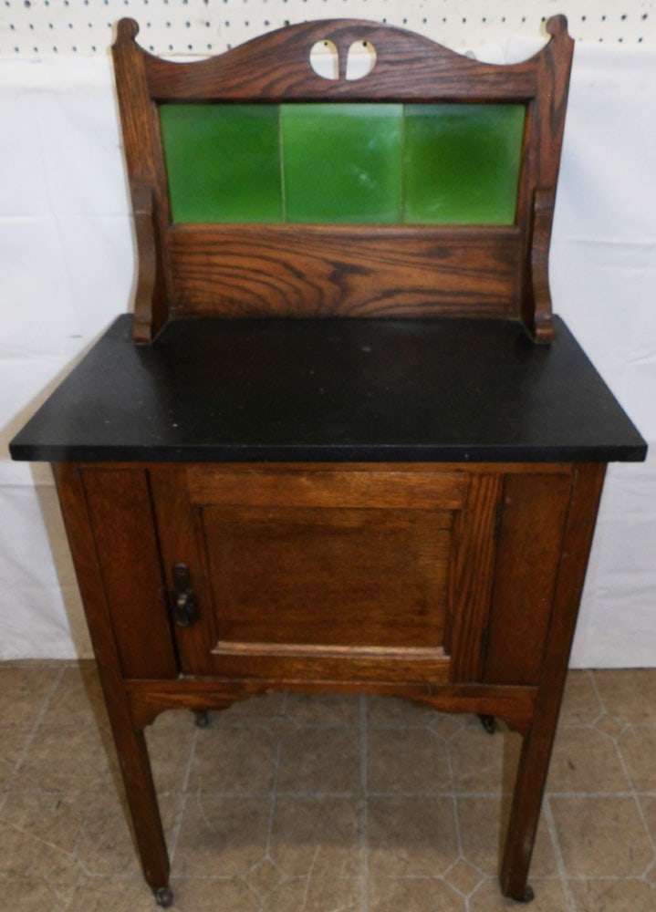 Antique Oak Marble Top Tile Back Washstand: Antique Oak Marble Top Tile Back Washstand . 44 1/2" H 24 1/4" W 16 1/4" D "ALL DESCRIPTIONS AND ANY CONDITION STATEMENT GIVEN BY LANGSTON AUCTION GALLERY ARE STRICTLY OPINIONS AND LANGSTON'S SHALL