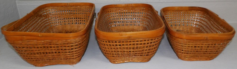 Three Graduated Bamboo Baskets: Three Graduated Bamboo Baskets . Up to 7" H 15 1/2" W 11 1/4" D "ALL DESCRIPTIONS AND ANY CONDITION STATEMENT GIVEN BY LANGSTON AUCTION GALLERY ARE STRICTLY OPINIONS AND LANGSTON'S SHALL HAVE NO