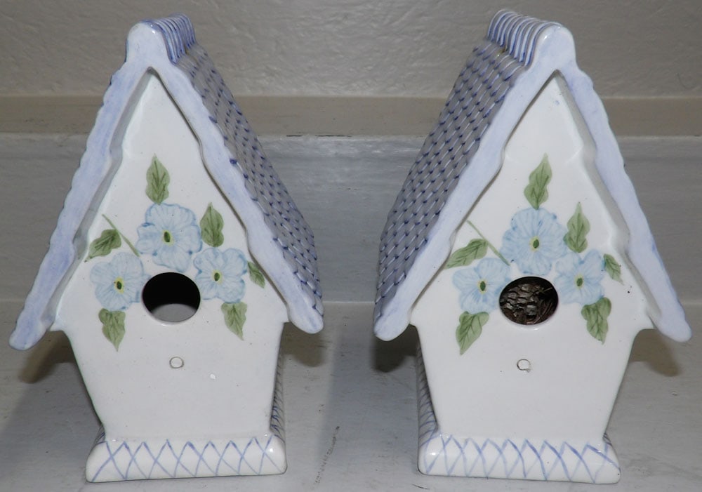 Two Painted Porcelain Bird Houses: Two Painted Porcelain Bird Houses . Up to 10" H 6 1/2" W 7" D "ALL DESCRIPTIONS AND ANY CONDITION STATEMENT GIVEN BY LANGSTON AUCTION GALLERY ARE STRICTLY OPINIONS AND LANGSTON'S SHALL HAVE NO
