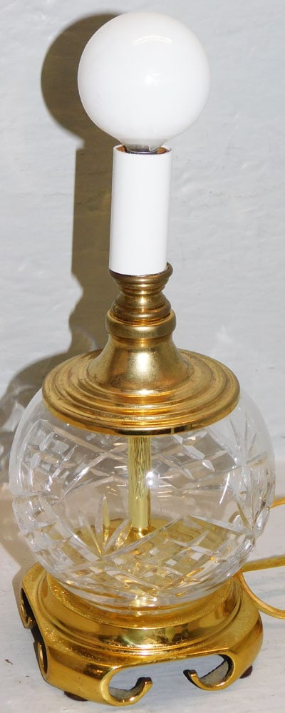 Crystal Waterford Style Dresser Lamp on Brass Base: Crystal Waterford Style Dresser Lamp on Brass Base . 8 1/2" H 4" Dia. "ALL DESCRIPTIONS AND ANY CONDITION STATEMENT GIVEN BY LANGSTON AUCTION GALLERY ARE STRICTLY OPINIONS AND LANGSTON'S SHALL HAVE NO