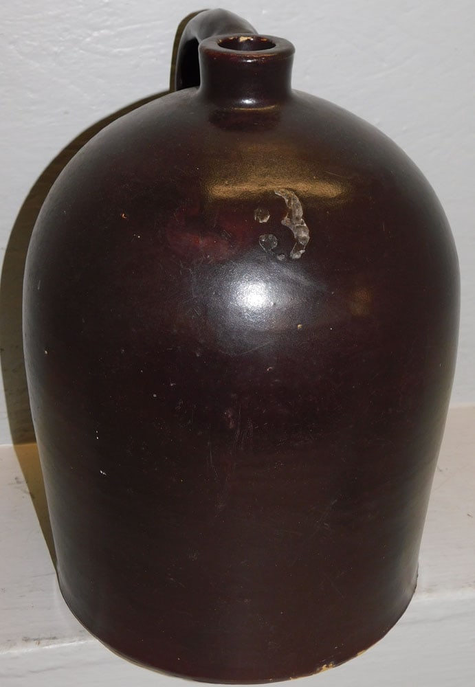 Three Gallon Brown Stoneware Whisky Jug: Three Gallon Brown Stoneware Whisky Jug. 14" H 9 1/2" W "ALL DESCRIPTIONS AND ANY CONDITION STATEMENT GIVEN BY LANGSTON AUCTION GALLERY ARE STRICTLY OPINIONS AND LANGSTON'S SHALL HAVE NO RESPONSIBILIT