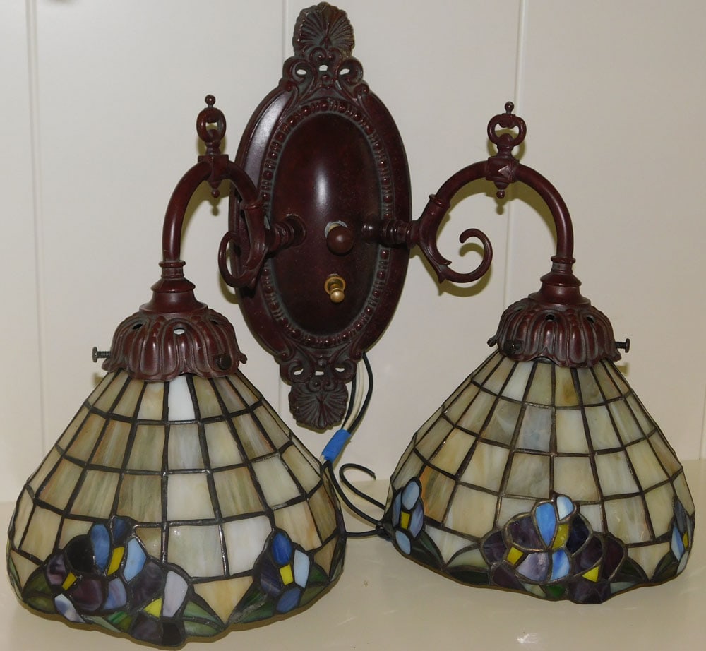 Ornate Painted Metal Two Light Wall Sconce with Leaded Stained Glass Shades: Ornate Painted Metal Two Light Wall Sconce with Leaded Stained Glass Shades. 6" H 12" W 6 1/2" Dia. "ALL DESCRIPTIONS AND ANY CONDITION STATEMENT GIVEN BY LANGSTON AUCTION GALLERY ARE STRICTLY