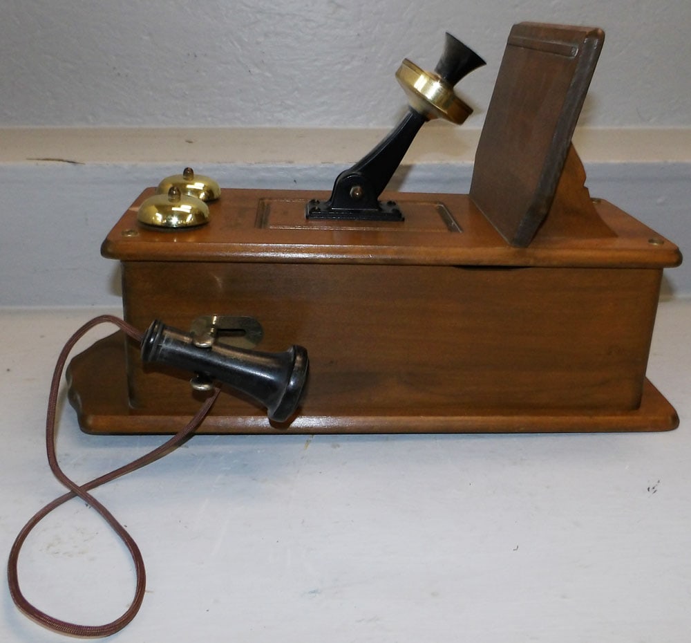 Vintage Maple Wall Phone: Vintage Maple Wall Phone. 18" H 7 1/4" W 11 1/4" D "ALL DESCRIPTIONS AND ANY CONDITION STATEMENT GIVEN BY LANGSTON AUCTION GALLERY ARE STRICTLY OPINIONS AND LANGSTON'S SHALL HAVE NO RESPONSIBILITY