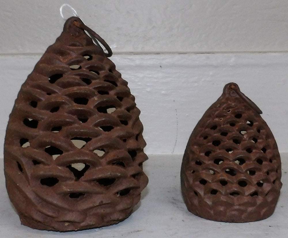 Two Cast Iron Pine Cone Form Lanterns: Two Cast Iron Pine Cone Form Lanterns . Up to 7 1/2" H 5" Dia. "ALL DESCRIPTIONS AND ANY CONDITION STATEMENT GIVEN BY LANGSTON AUCTION GALLERY ARE STRICTLY OPINIONS AND LANGSTON'S SHALL HAVE NO