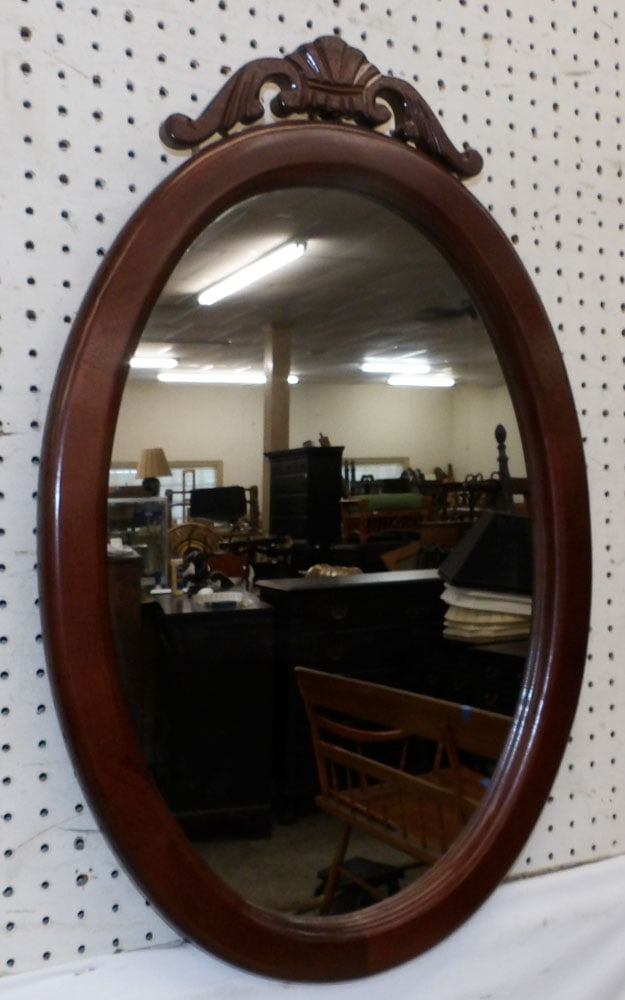 Oval Mahogany Framed Mirror: Oval Mahogany Framed Mirror. 28 3/4" x 18 3/4" "ALL DESCRIPTIONS AND ANY CONDITION STATEMENT GIVEN BY LANGSTON AUCTION GALLERY ARE STRICTLY OPINIONS AND LANGSTON'S SHALL HAVE NO RESPONSIBILITY FOR ERR