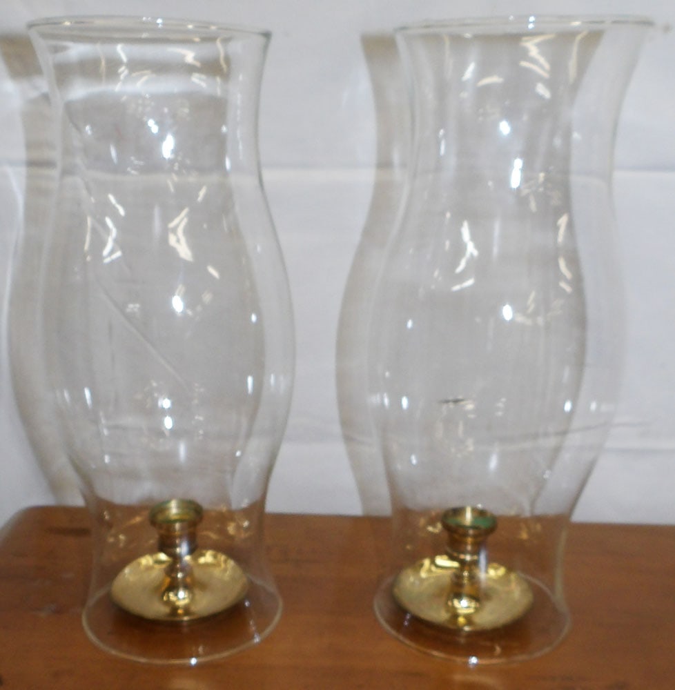 Pair of Brass Candlesticks with Glass Hurricane Shades: Pair of Brass Candlesticks with Glass Hurricane Shades . 13 1/2" H 5" Dia. "ALL DESCRIPTIONS AND ANY CONDITION STATEMENT GIVEN BY LANGSTON AUCTION GALLERY ARE STRICTLY OPINIONS AND LANGSTON'S SHALL