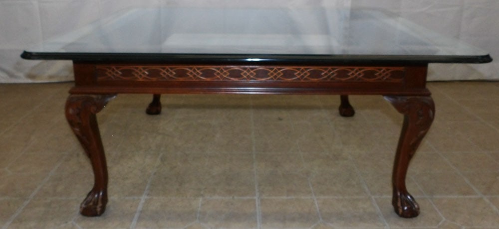 Cherry & Glass Top Coffee Table with Ball & Claw Feet: Cherry & Glass Top Coffee Table with Ball & Claw Feet. 17" H 39 3/4" W 40 1/2" D "ALL DESCRIPTIONS AND ANY CONDITION STATEMENT GIVEN BY LANGSTON AUCTION GALLERY ARE STRICTLY OPINIONS AND LANGSTON'S