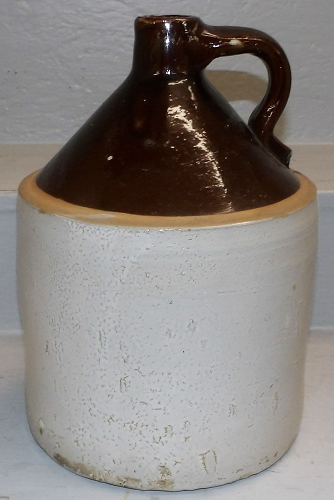 Stoneware Two Gallon Whisky Jug: Stoneware Two Gallon Whisky Jug. 13" H 9 1/4" Dia. "ALL DESCRIPTIONS AND ANY CONDITION STATEMENT GIVEN BY LANGSTON AUCTION GALLERY ARE STRICTLY OPINIONS AND LANGSTON'S SHALL HAVE NO RESPONSIBILITY