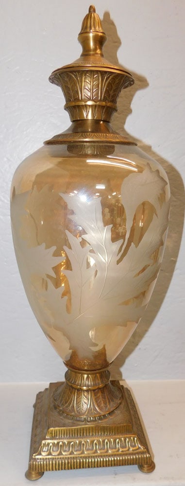Decorative Brass & Etched Iridescent Glass Urn: Decorative Brass & Etched Iridescent Glass Urn. 21 1/4" H 7" Dia. "ALL DESCRIPTIONS AND ANY CONDITION STATEMENT GIVEN BY LANGSTON AUCTION GALLERY ARE STRICTLY OPINIONS AND LANGSTON'S SHALL HAVE NO