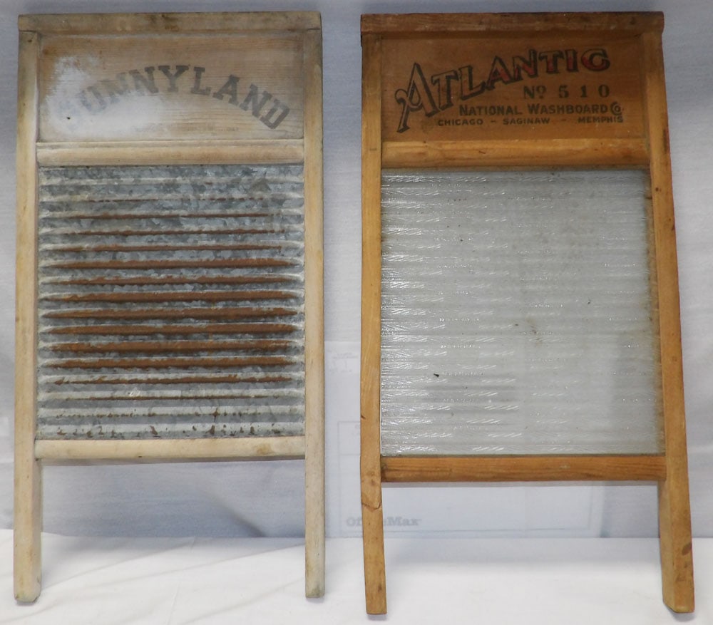 Two Antique Washboards: Two Antique Washboards . Up to 24" x 12 1/2" "ALL DESCRIPTIONS AND ANY CONDITION STATEMENT GIVEN BY LANGSTON AUCTION GALLERY ARE STRICTLY OPINIONS AND LANGSTON'S SHALL HAVE NO RESPONSIBILITY FOR