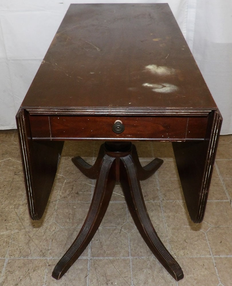 Mahogany Drop Leaf Table: Mahogany Drop Leaf Table . 29 1/2" H 38" W 17 1/2" D "ALL DESCRIPTIONS AND ANY CONDITION STATEMENT GIVEN BY LANGSTON AUCTION GALLERY ARE STRICTLY OPINIONS AND LANGSTON'S SHALL HAVE NO RESPONSIBILITY