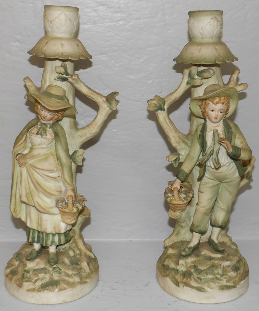 Pair of Bisque Candlesticks: Pair of Bisque Candlesticks . 11 1/4" H 4 1/2" W "ALL DESCRIPTIONS AND ANY CONDITION STATEMENT GIVEN BY LANGSTON AUCTION GALLERY ARE STRICTLY OPINIONS AND LANGSTON'S SHALL HAVE NO RESPONSIBILITY FOR