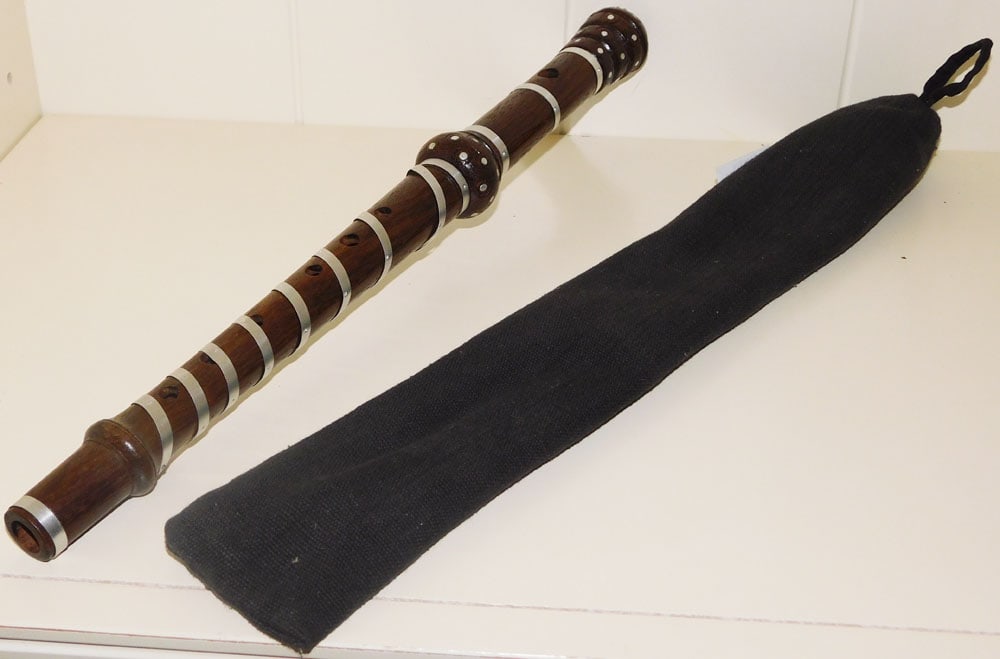 Hand Carved Nepali Walnut Folk Flute with Metal Banding: Hand Carved Nepali Walnut Folk Flute with Metal Banding . 17" L "ALL DESCRIPTIONS AND ANY CONDITION STATEMENT GIVEN BY LANGSTON AUCTION GALLERY ARE STRICTLY OPINIONS AND LANGSTON'S SHALL HAVE NO