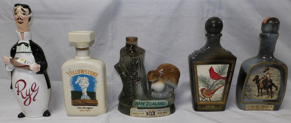 Lot of Painted Porcelain Decanters: Lot of Painted Porcelain Decanters . Up to 12" H 3 1/2" W ALL DESCRIPTIONS AND ANY CONDITION STATEMENT GIVEN BY LANGSTON AUCTION GALLERY ARE STRICTLY OPINIONS AND LANGSTON'S SHALL HAVE NO RESPONSIBILI