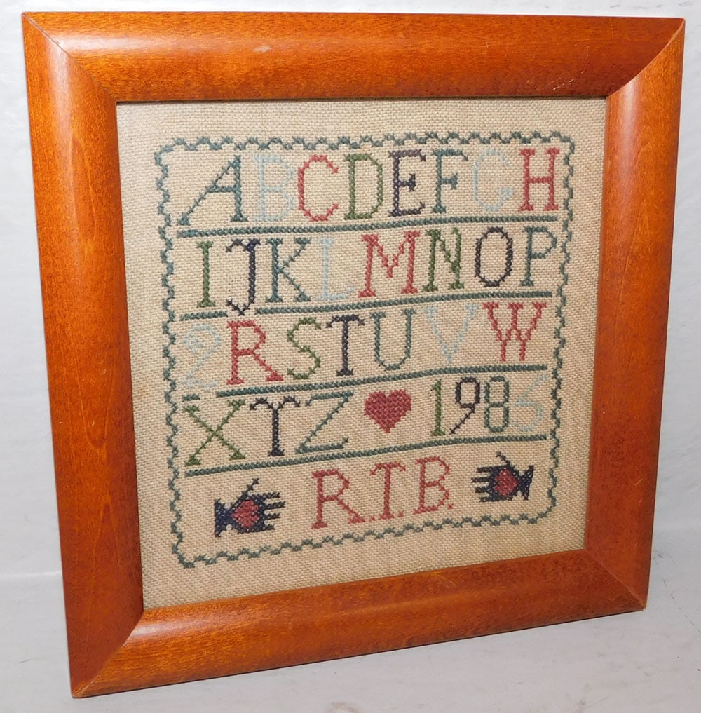 Needlework Sampler Dated 1985 in Maple Frame (1 of 2)