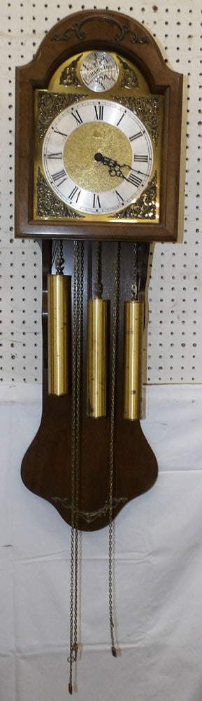 Maple & Brass Wall Clock: Maple & Brass Wall Clock . 40" H 12" W 7 1/2" D ALL DESCRIPTIONS AND ANY CONDITION STATEMENT GIVEN BY LANGSTON AUCTION GALLERY ARE STRICTLY OPINIONS AND LANGSTON'S SHALL HAVE NO RESPONSIBILITY FOR ERR