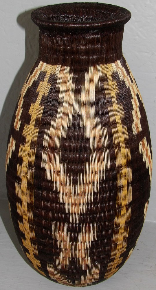 Vintage South American Hand Woven Geometrical Motif Basket Vase: Vintage South American Hand Woven Geometrical Motif Basket Vase . 15" H 7 1/2" Dia. ALL DESCRIPTIONS AND ANY CONDITION STATEMENT GIVEN BY LANGSTON AUCTION GALLERY ARE STRICTLY OPINIONS AND LANGSTON'S
