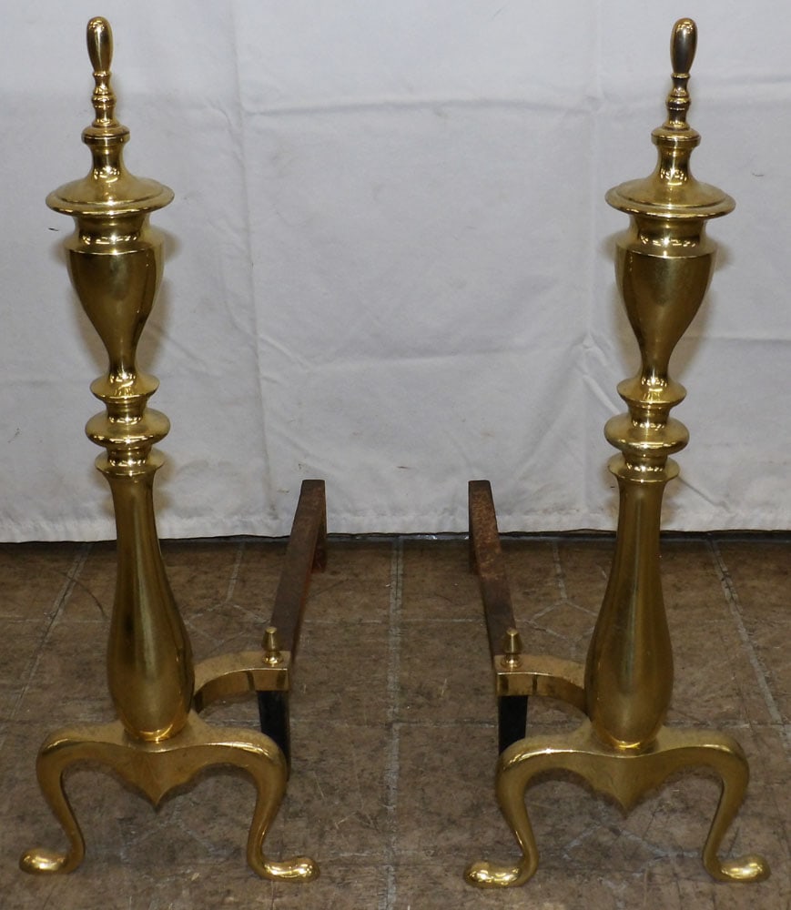 Pair of Brass Andirons: Pair of Brass Andirons . 22" H 8" W 18 1/2" D ALL DESCRIPTIONS AND ANY CONDITION STATEMENT GIVEN BY LANGSTON AUCTION GALLERY ARE STRICTLY OPINIONS AND LANGSTON'S SHALL HAVE NO RESPONSIBILITY FOR