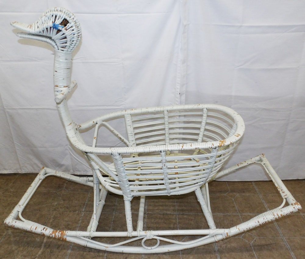Antique Painted Wicker Duck Form Rocking Cradle: Antique Painted Wicker Duck Form Rocking Cradle . 36" H 14" W 44 1/2" D ALL DESCRIPTIONS AND ANY CONDITION STATEMENT GIVEN BY LANGSTON AUCTION GALLERY ARE STRICTLY OPINIONS AND LANGSTON'S SHALL HAVE