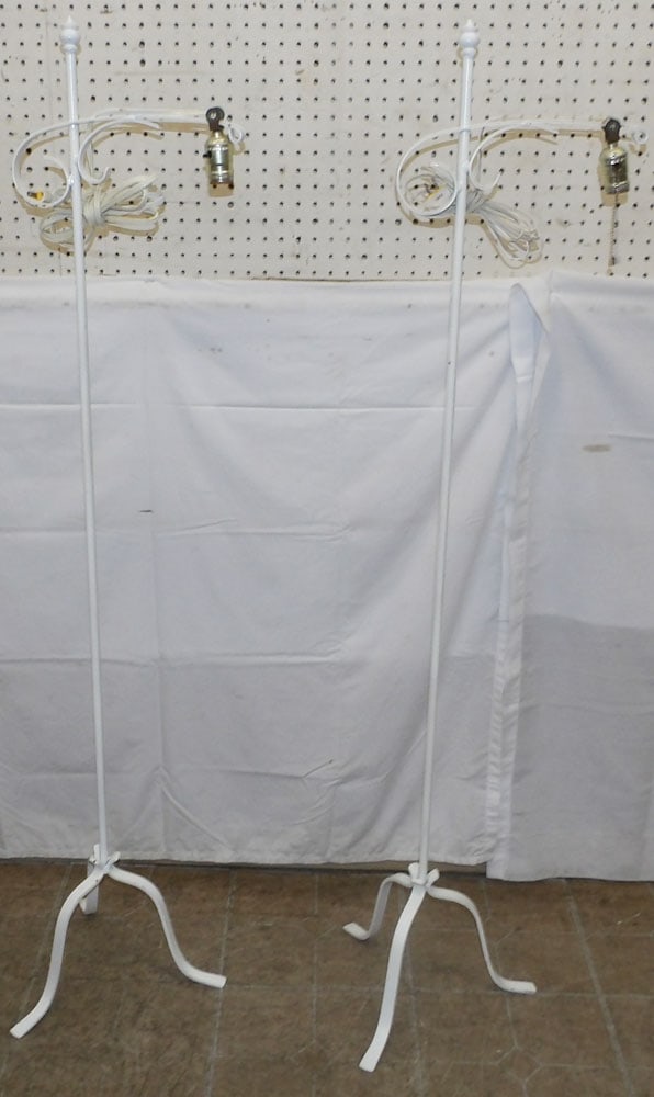 Pair of Painted Wrought Iron Floor Lamps: Pair of Painted Wrought Iron Floor Lamps . 57" H 12" W ALL DESCRIPTIONS AND ANY CONDITION STATEMENT GIVEN BY LANGSTON AUCTION GALLERY ARE STRICTLY OPINIONS AND LANGSTON'S SHALL HAVE NO RESPONSIBILITY