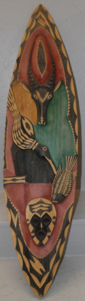 Painted Carved Wood Shield: Painted Carved Wood Shield . 38 1/4" x 10" ALL DESCRIPTIONS AND ANY CONDITION STATEMENT GIVEN BY LANGSTON AUCTION GALLERY ARE STRICTLY OPINIONS AND LANGSTON'S SHALL HAVE NO RESPONSIBILITY FOR ERRORS