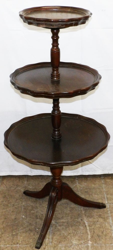 Mahogany Three Tier Dumbwaiter: Mahogany Three Tier Dumbwaiter . 41" H 19 3/4" Dia. ALL DESCRIPTIONS AND ANY CONDITION STATEMENT GIVEN BY LANGSTON AUCTION GALLERY ARE STRICTLY OPINIONS AND LANGSTON'S SHALL HAVE NO RESPONSIBILITY