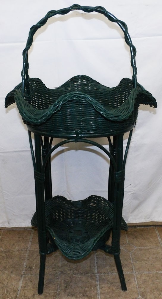 Painted Wicker Two Tier Basket Form Stand: Painted Wicker Two Tier Basket Form Stand . 38 1/2" H 18" W ALL DESCRIPTIONS AND ANY CONDITION STATEMENT GIVEN BY LANGSTON AUCTION GALLERY ARE STRICTLY OPINIONS AND LANGSTON'S SHALL HAVE NO RESPONSIBI