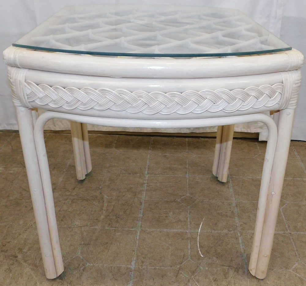 Painted Rattan End Table with Glass Top: Painted Rattan End Table with Glass Top. 23" H 22" W 26" D ALL DESCRIPTIONS AND ANY CONDITION STATEMENT GIVEN BY LANGSTON AUCTION GALLERY ARE STRICTLY OPINIONS AND LANGSTON'S SHALL HAVE NO