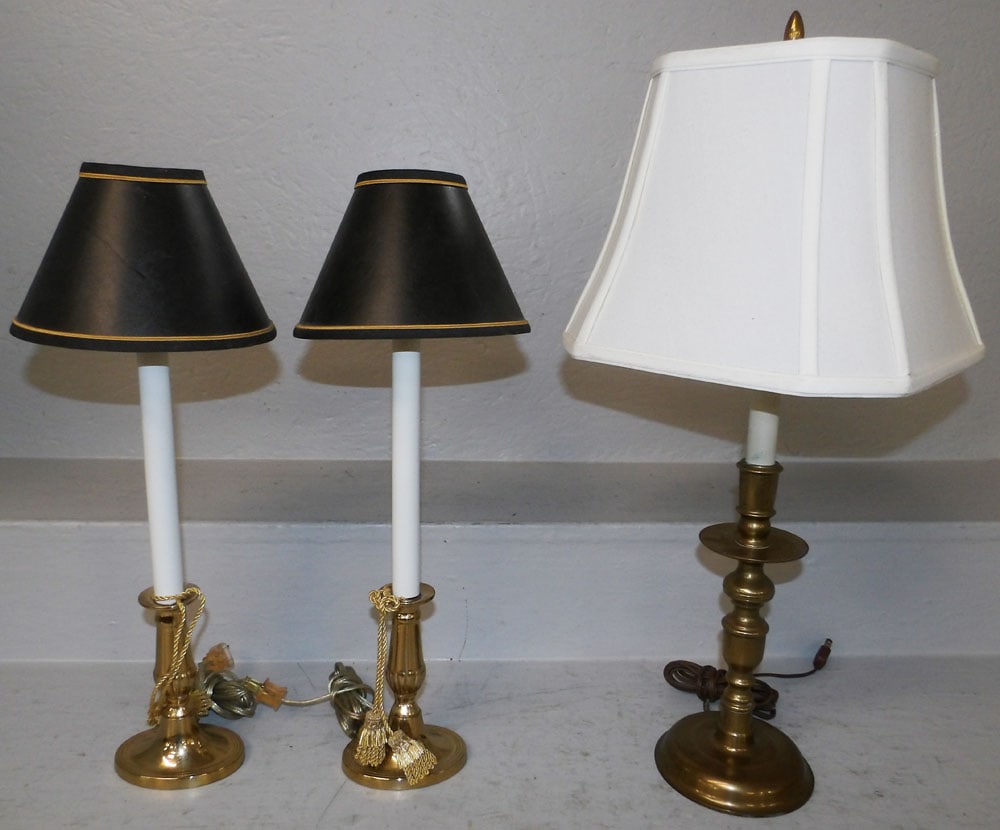 Three Brass Candlestick Lamps: Three Brass Candlestick Lamps . 23" H 10 1/2" Dia. ALL DESCRIPTIONS AND ANY CONDITION STATEMENT GIVEN BY LANGSTON AUCTION GALLERY ARE STRICTLY OPINIONS AND LANGSTON'S SHALL HAVE NO RESPONSIBILITY FOR