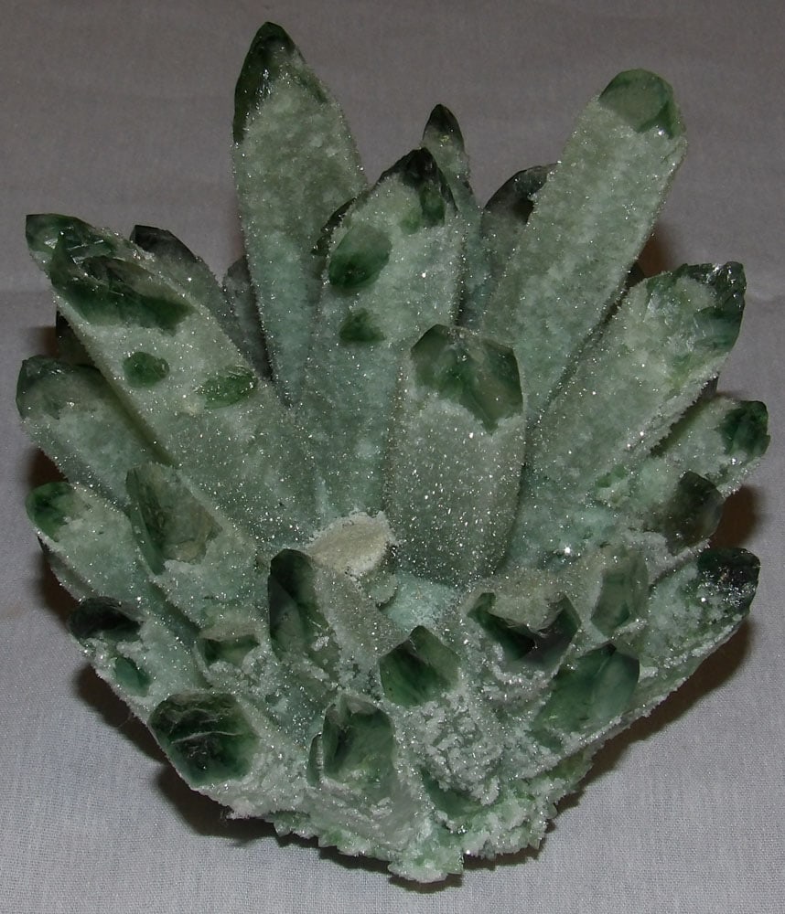 Green Quartz Rock: Green Quartz Rock . 4 3/4" H 4 1/2" Dia. ALL DESCRIPTIONS AND ANY CONDITION STATEMENT GIVEN BY LANGSTON AUCTION GALLERY ARE STRICTLY OPINIONS AND LANGSTON'S SHALL HAVE NO RESPONSIBILITY FOR ERRORS OR